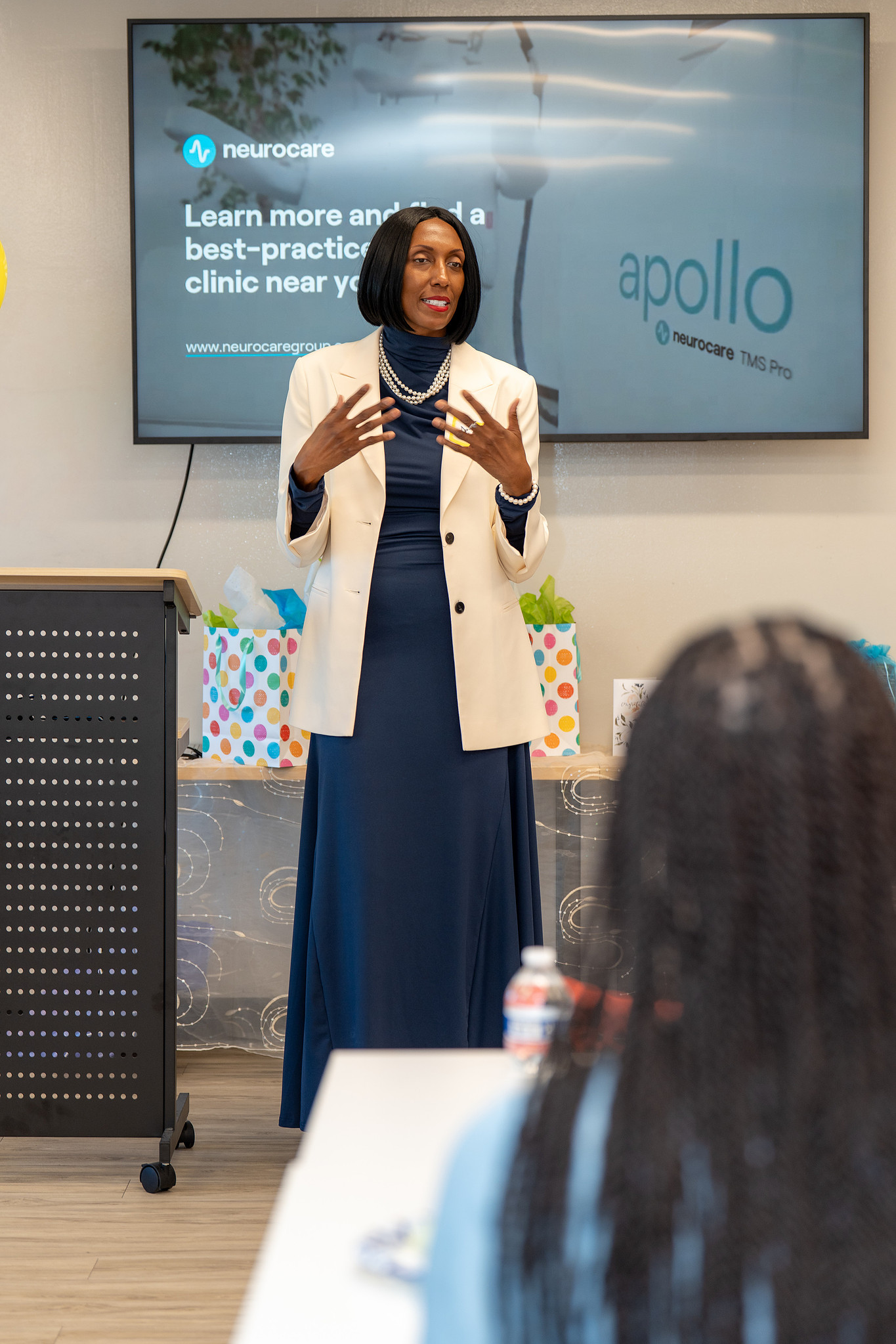 GlobeCoRe team member presenting on TMS therapy and neurocare services